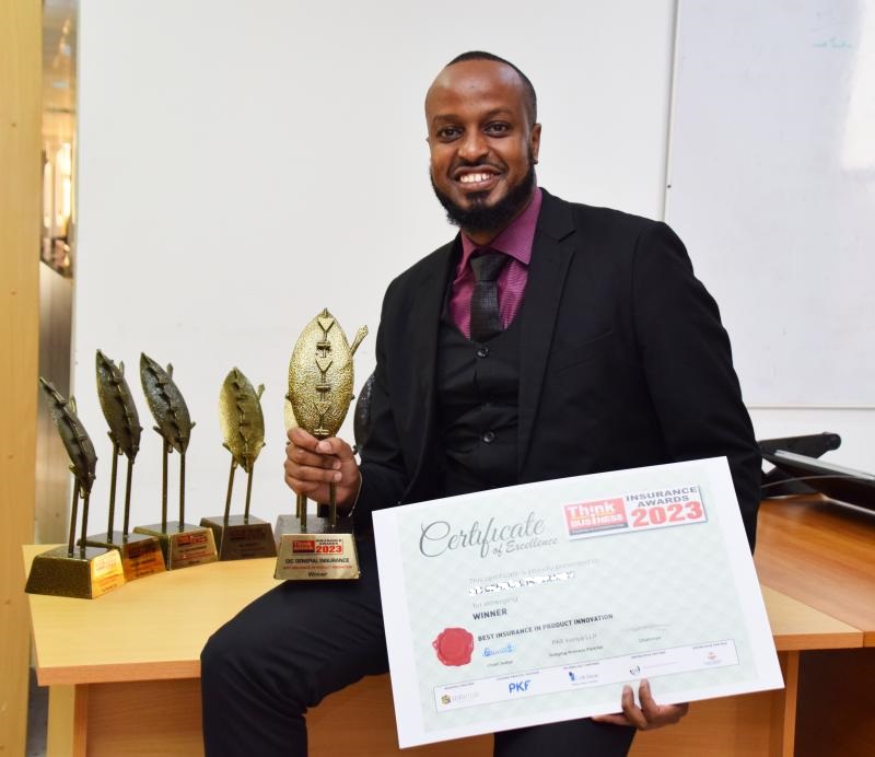 Michael Ayodi receiving the Think Business Insurance Award 2023
